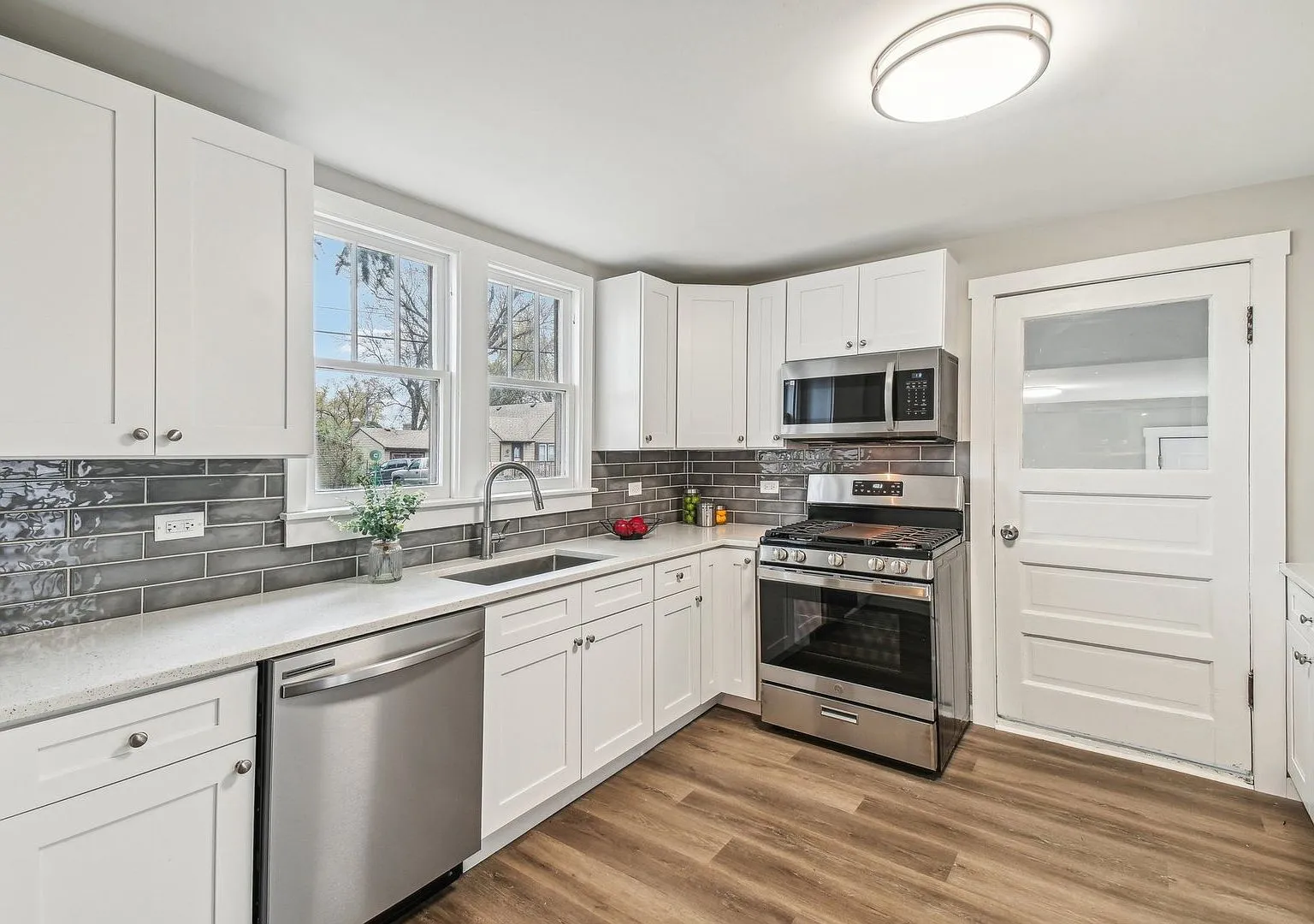 Renovated white kitchen with new appliances and backsplash, Lake Villa IL case study