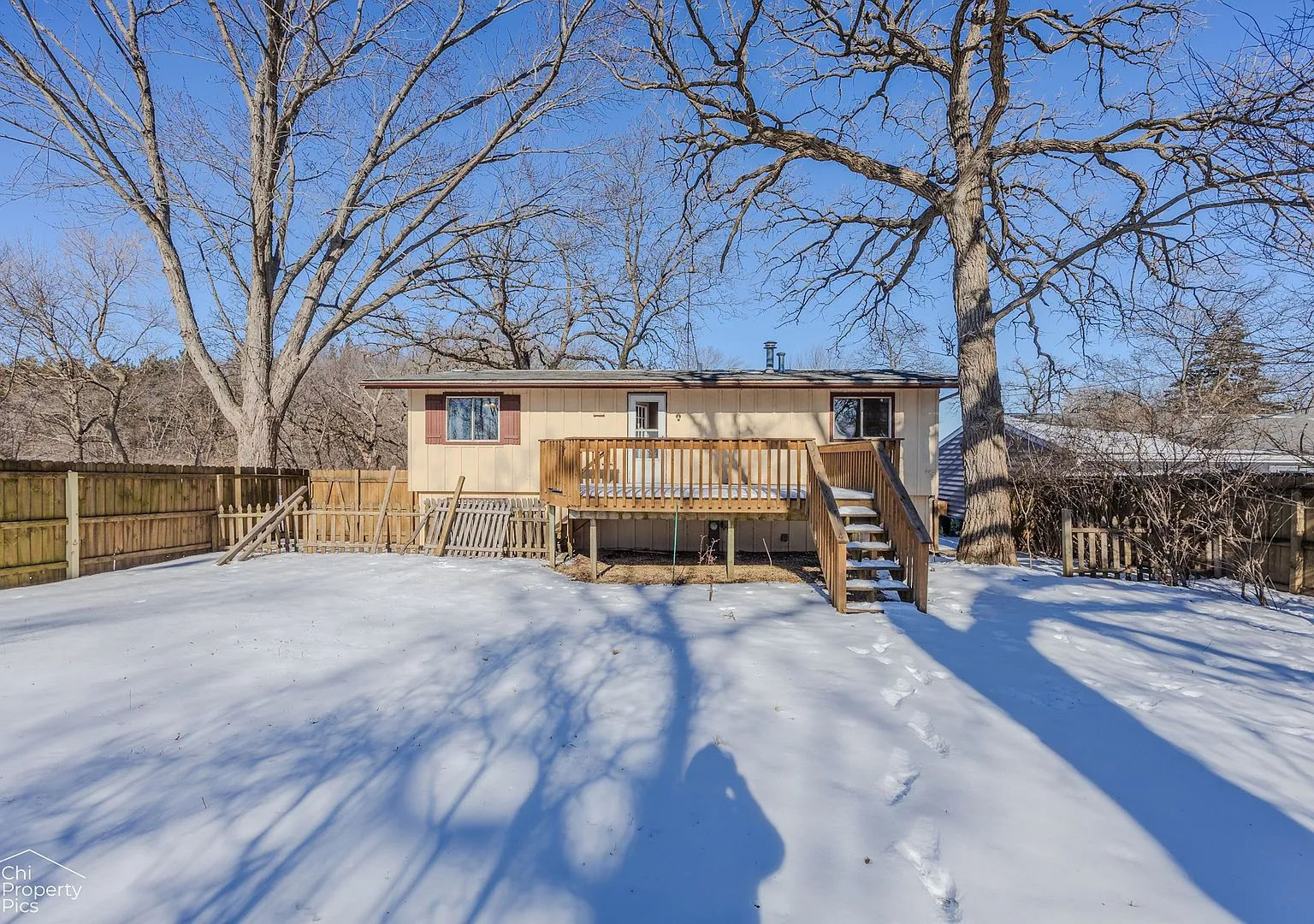 Backyard and deck of the McHenry two-story in winter