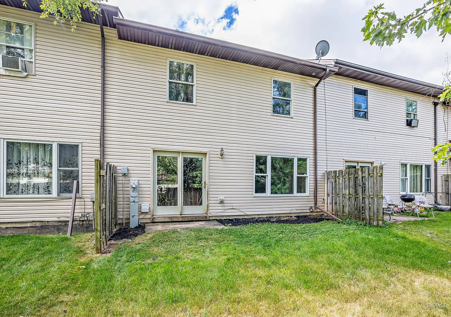 Rear exterior and yard of the Harvard home