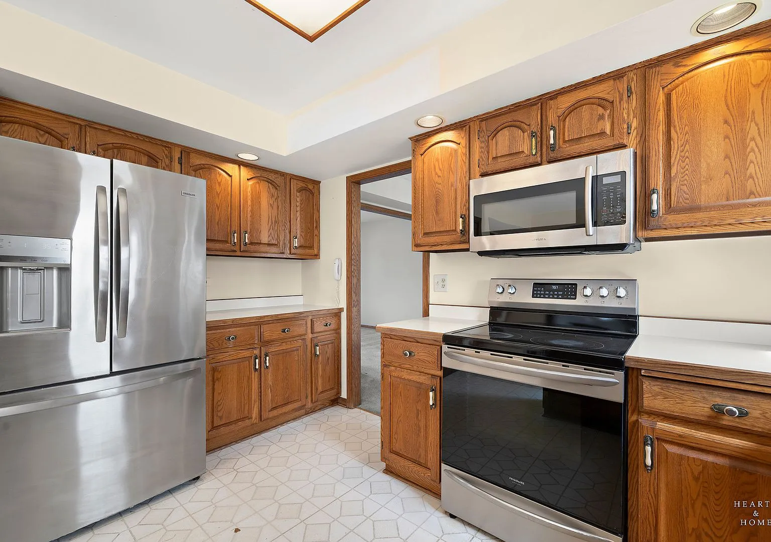 Kitchen with original oak cabinets and stainless appliances after deep cleaning, Elgin IL case study