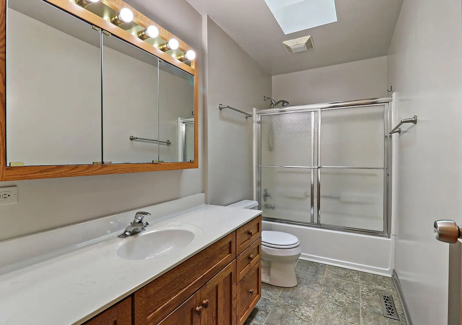 Original bathroom with dated vanity and tub, Crystal Lake IL