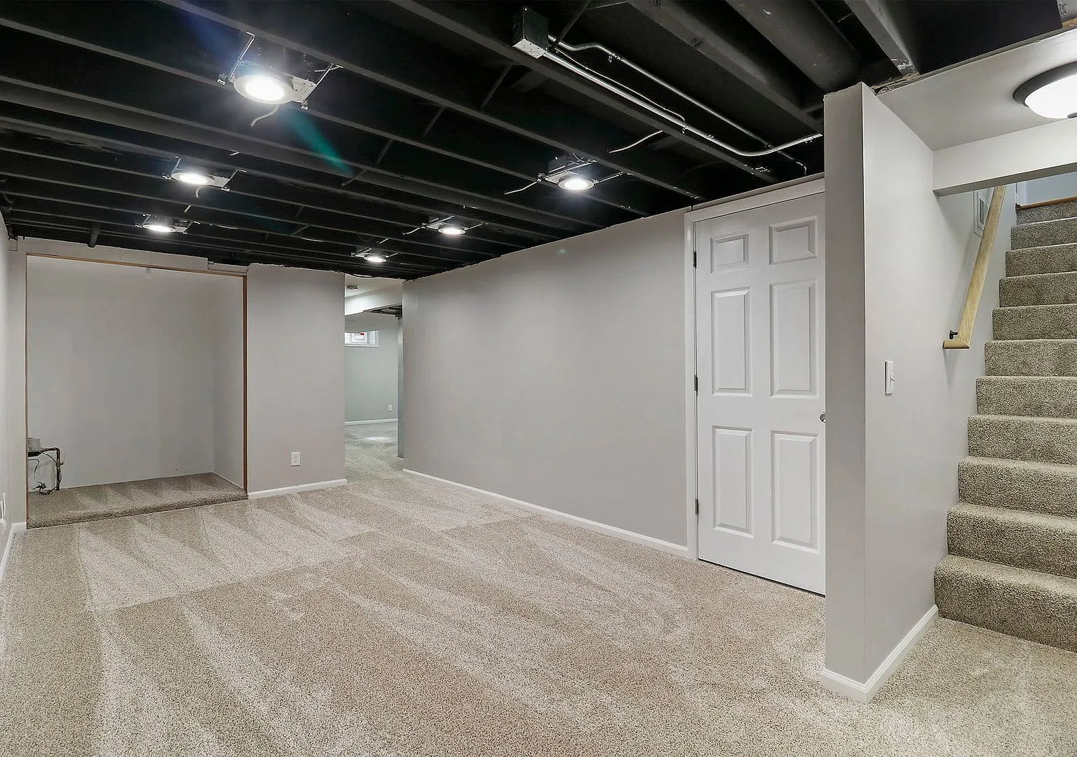 Finished basement with new carpet and dramatic black ceiling, Cary IL ranch