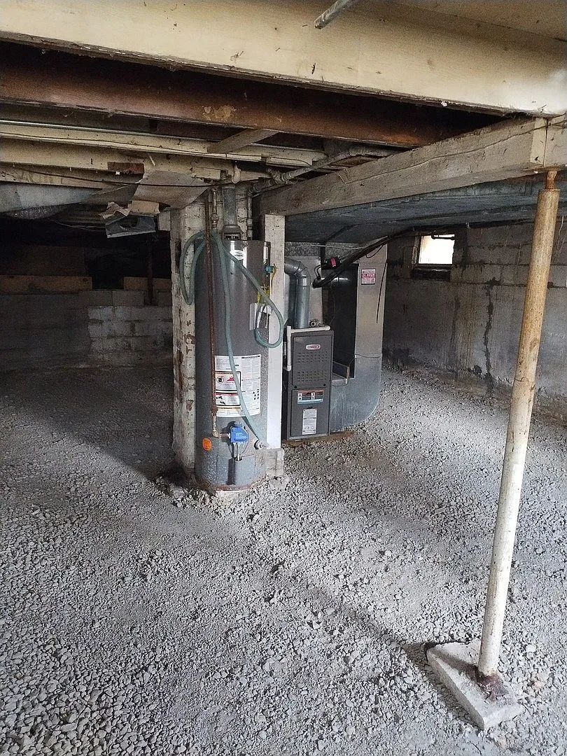 Basement with furnace and temporary support posts under the floor structure, Lakemoor IL