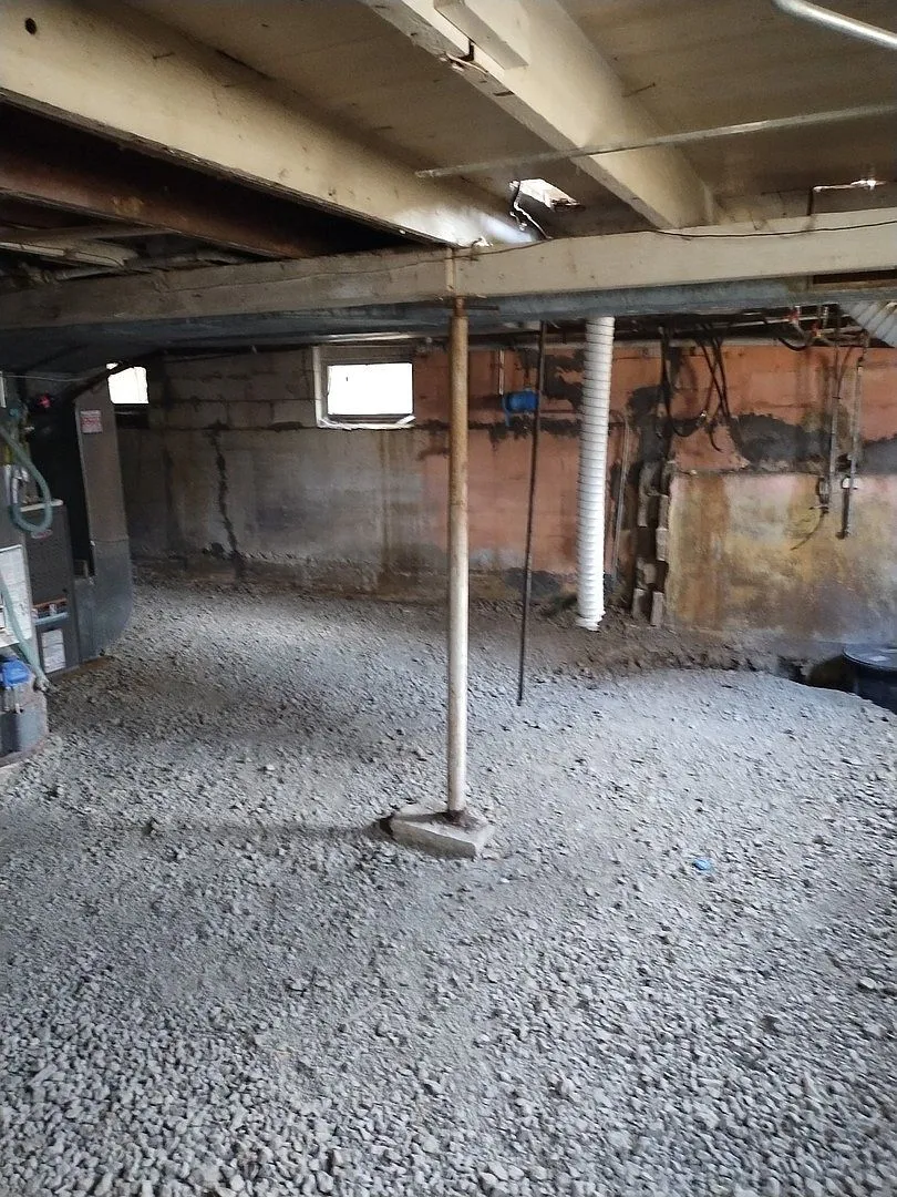 Temporary shoring posts against the basement foundation wall, 207 S Highland Dr