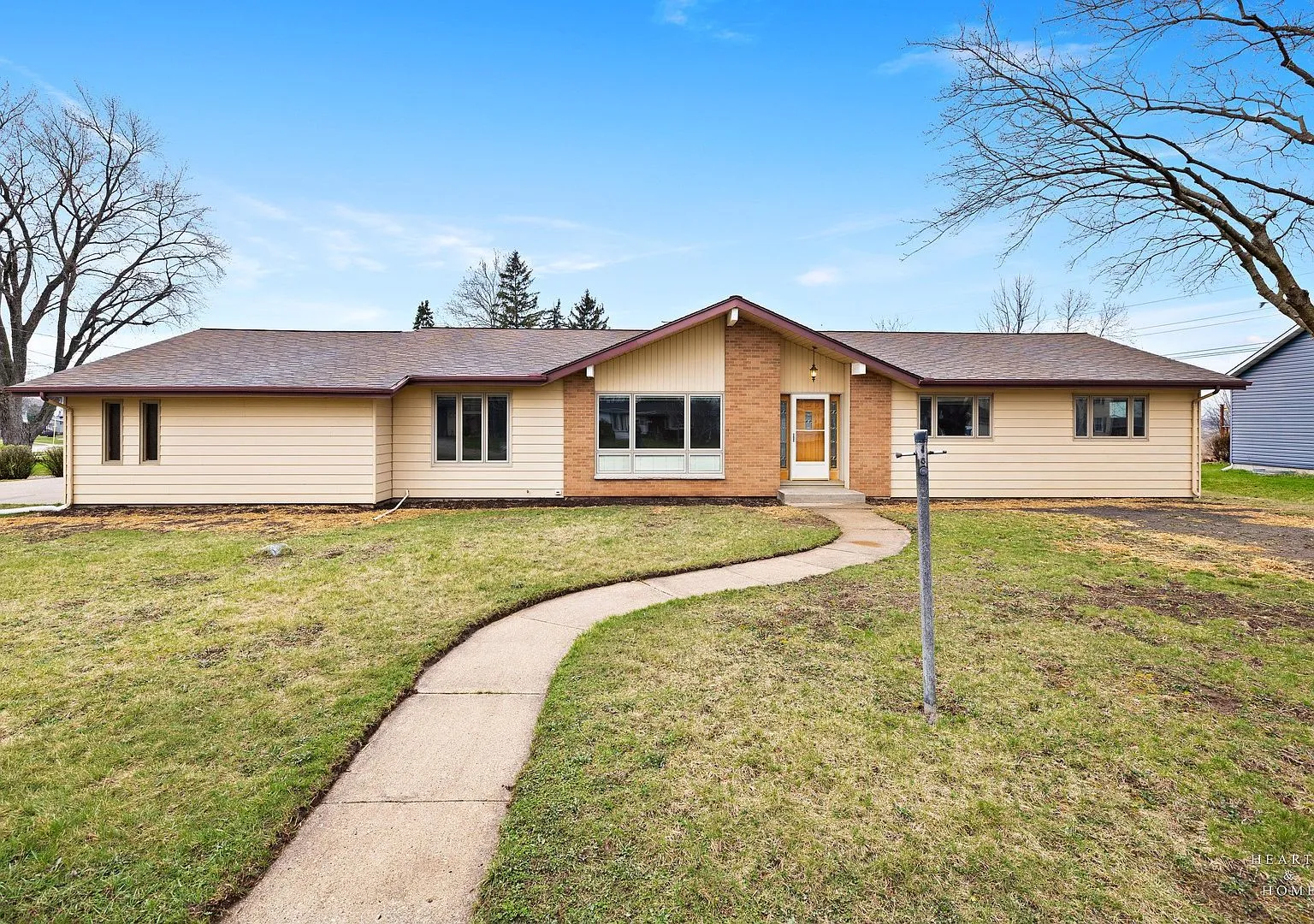 Front exterior of the 1965 ranch at 10817 Bonnie Brae Rd, Huntley, IL on its large lot