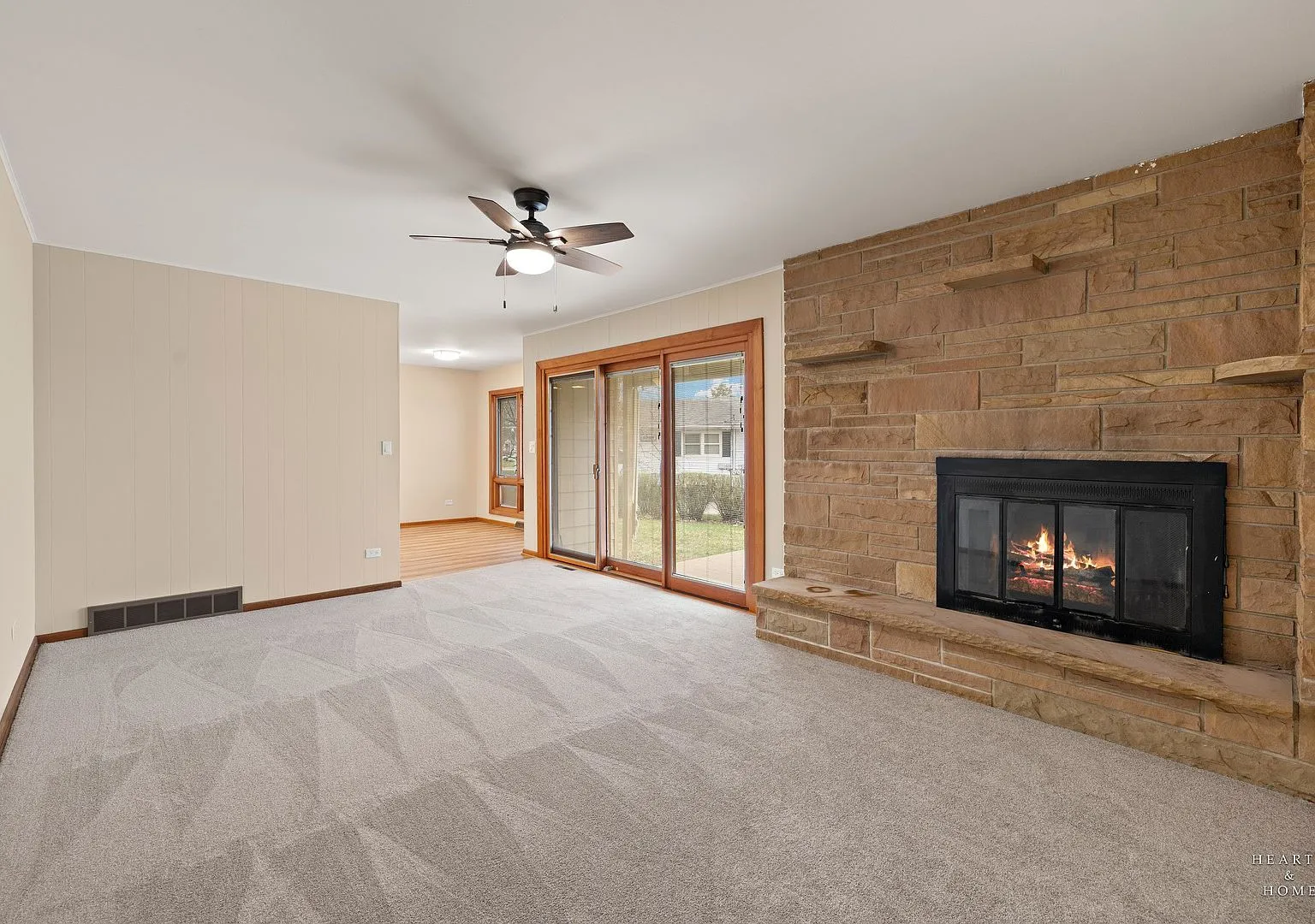 Family room with stone fireplace and new carpet, 10817 Bonnie Brae Rd Huntley