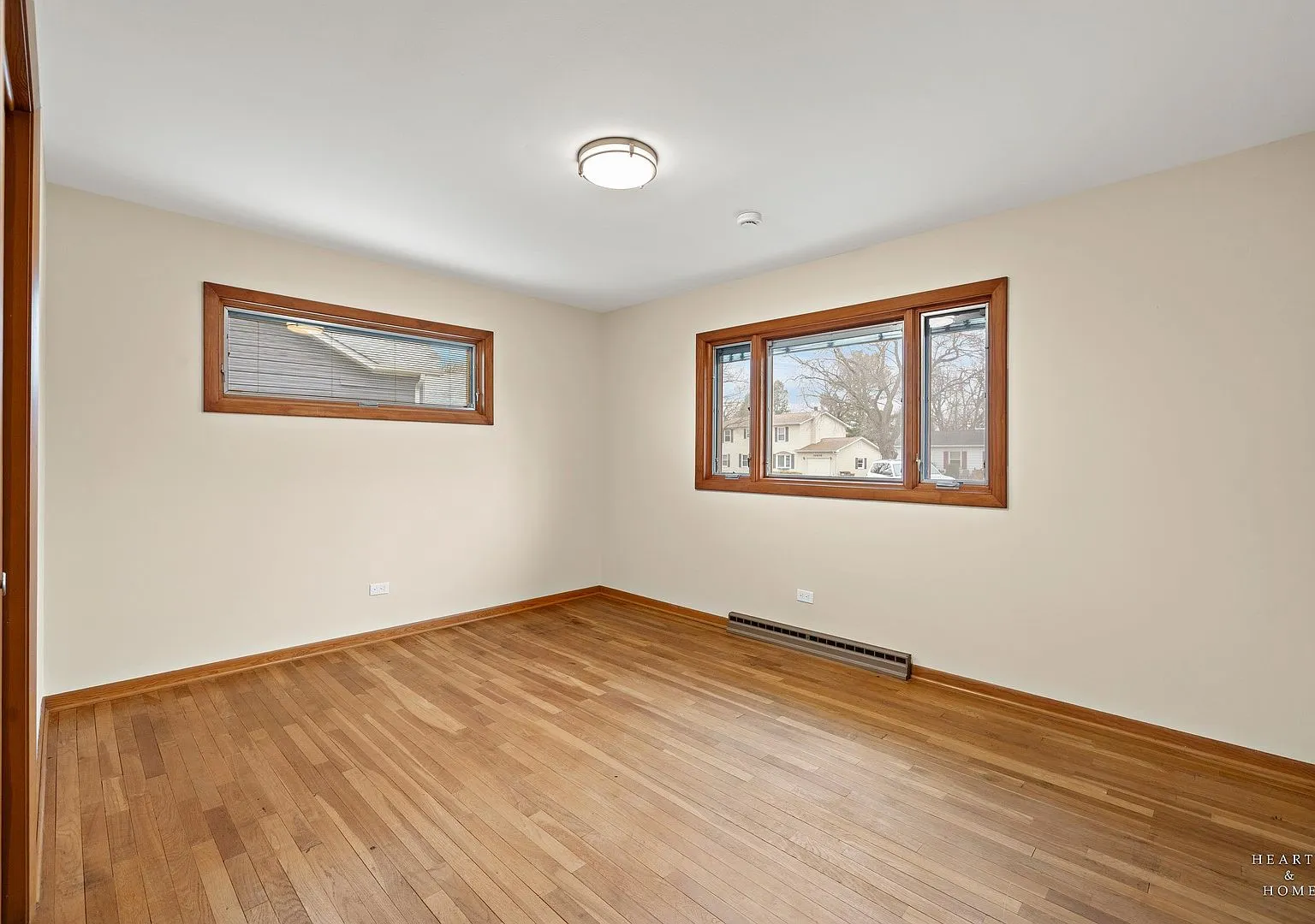 Bedroom with refreshed hardwood floors and original wood trim, Huntley IL