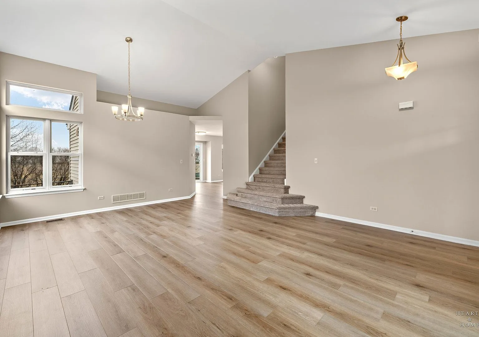 Foyer and staircase with new flooring and fresh paint, Lake in the Hills case study