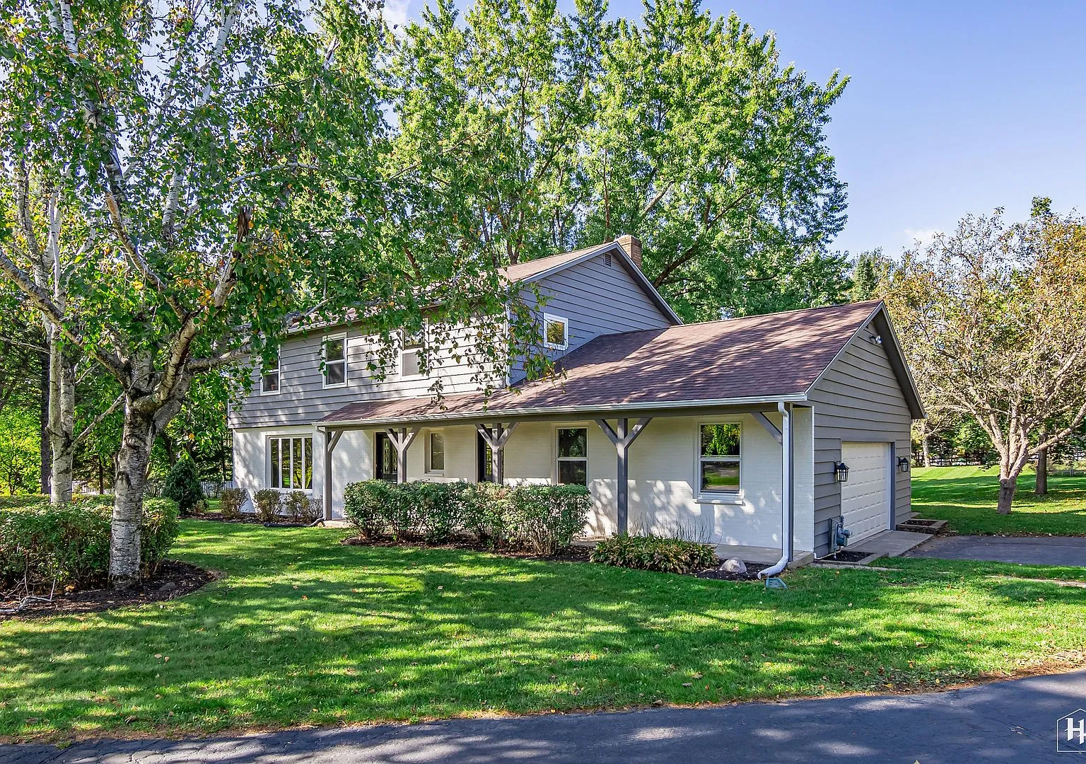 Two-story home on a large treed lot on Shannon Dr, Woodstock, IL after refresh