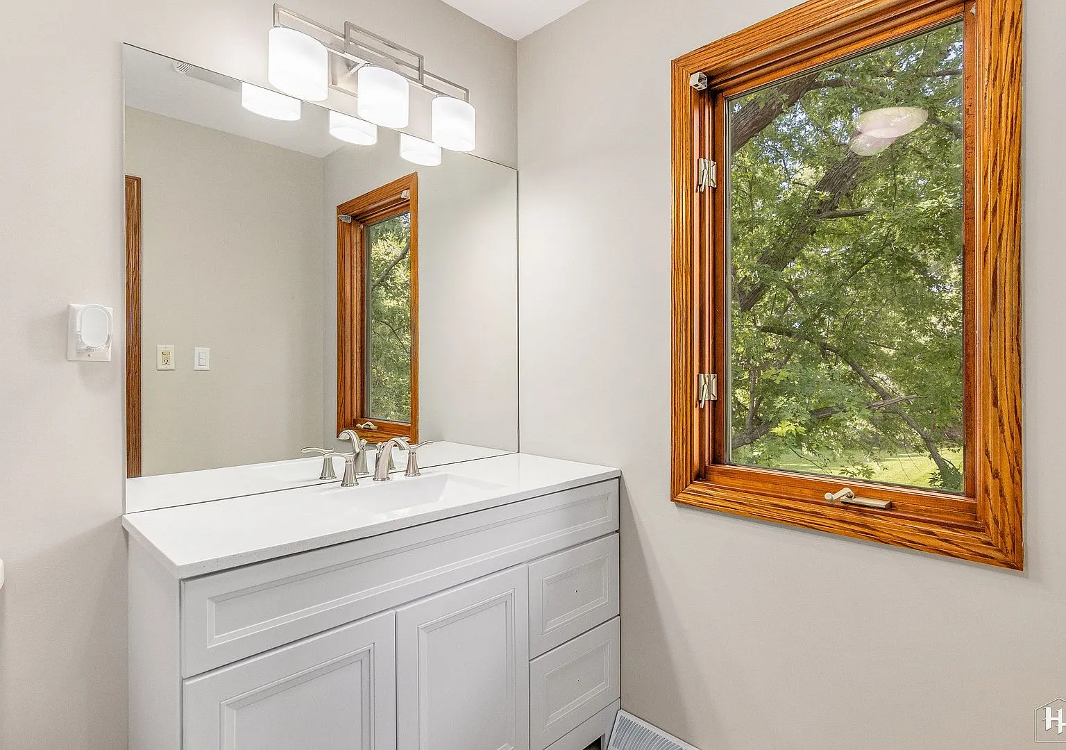 Bathroom with white vanity after touch-ups, Woodstock IL case study