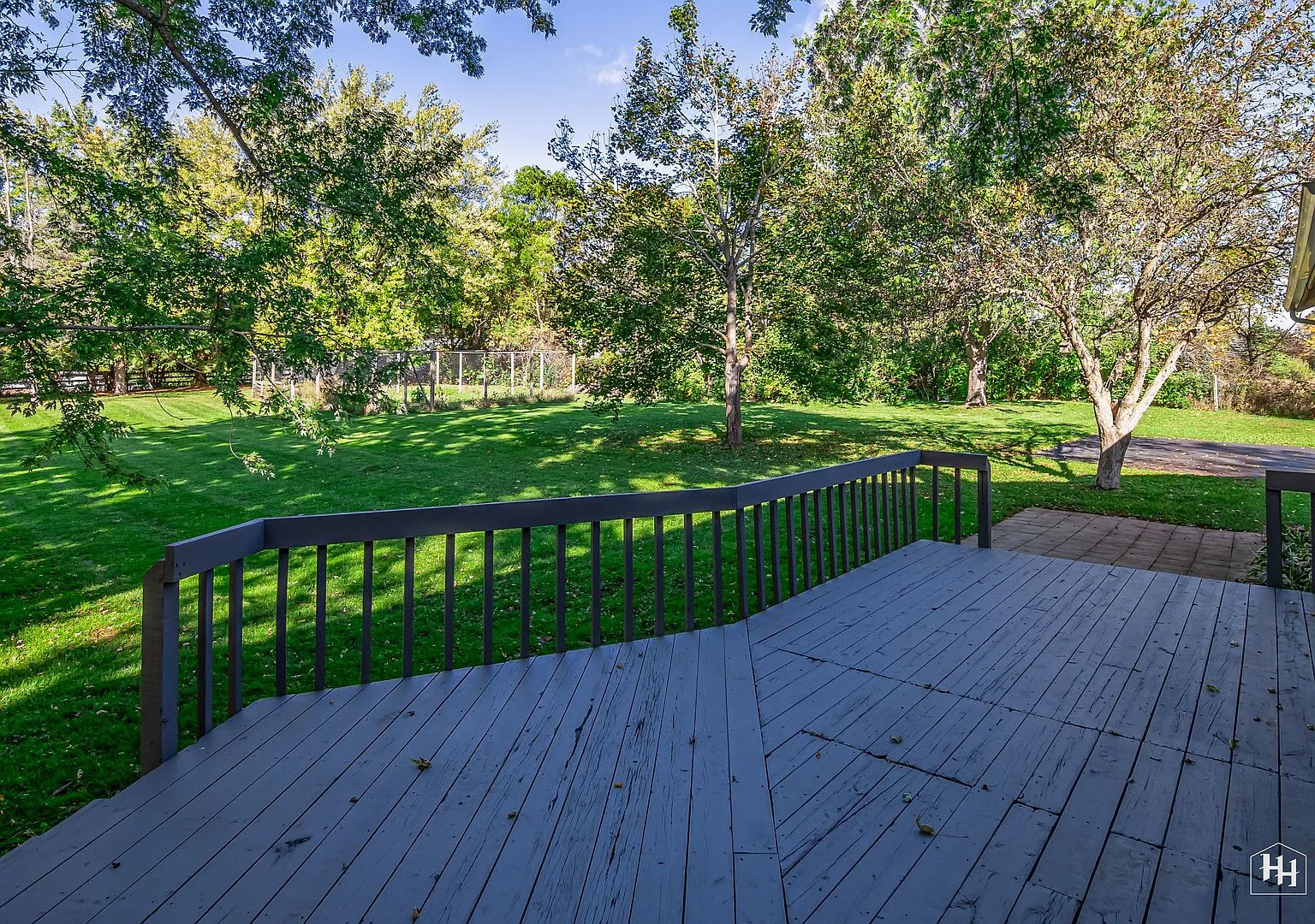 Large wood deck overlooking the treed backyard, Shannon Dr Woodstock