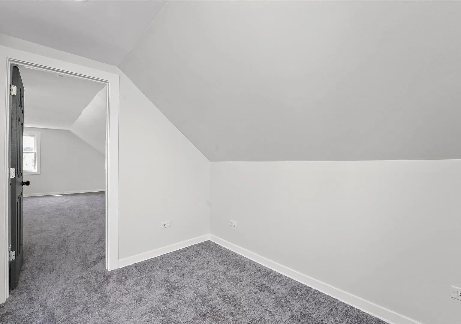 Finished attic bedroom with new carpet and sloped ceilings, Portage Park Chicago home