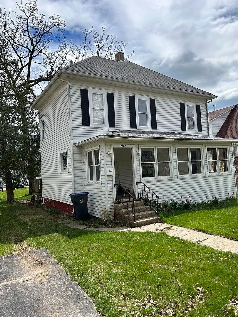Front exterior of the 1906 four-square at 2607 Elizabeth Ave, Zion, IL as purchased